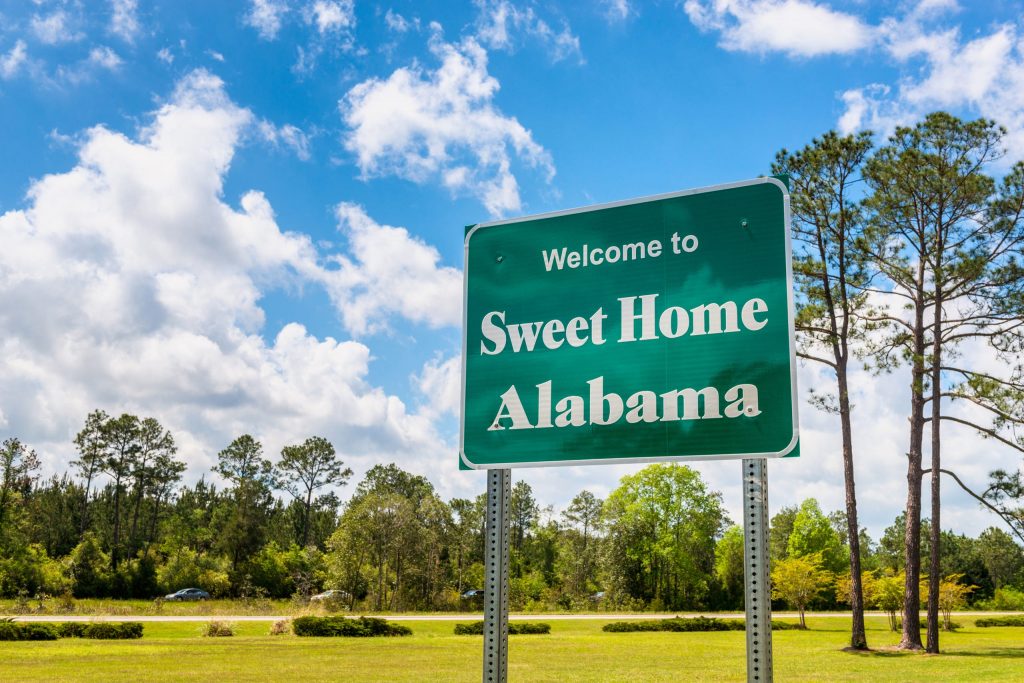 Sign welcoming travelers to the state of Alabama, which offers many scholarships