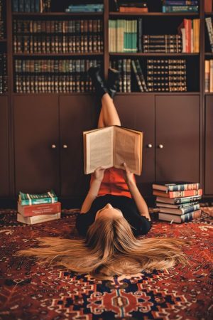 High school junior reading a book