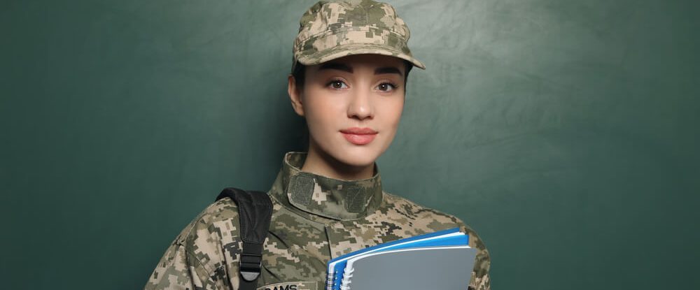 Veteran holds notebooks as she gets ready to study and wonders, 